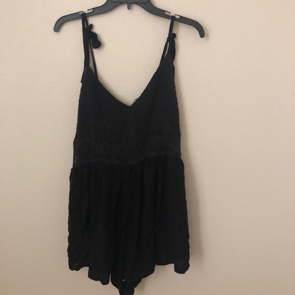 Flowy black romper with mesh paneling